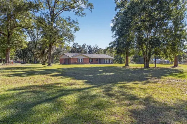 a backyard of a house with lots of green space