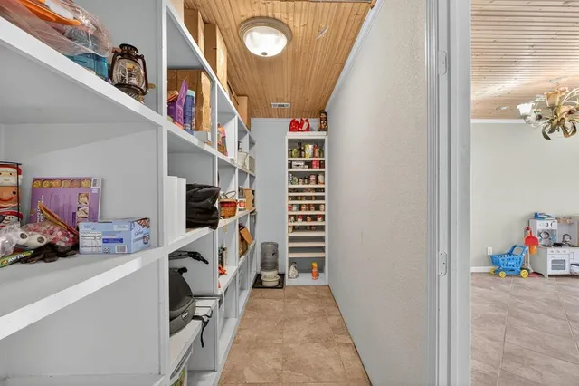 a view of a hallway with workspace and entryway