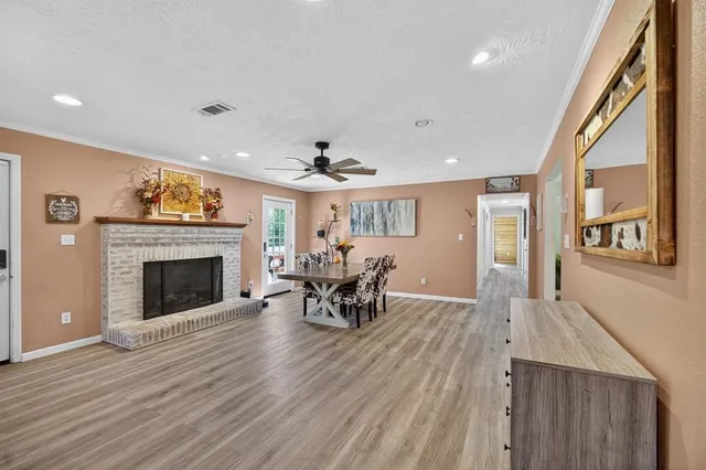 a view of a livingroom with furniture and a fireplace