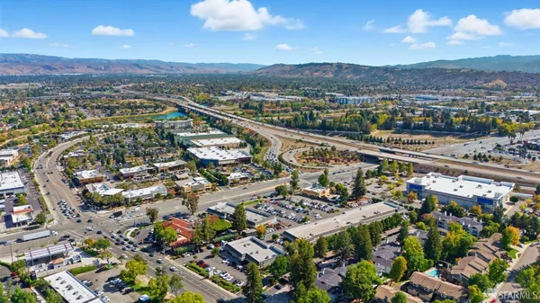 an aerial view of residential houses with outdoor space