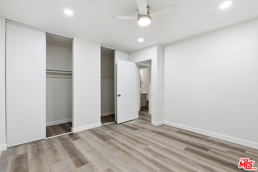 4836 Hollow Corner Road, Unit 312 Culver City, CA 90230 - Photo 12 of 29 a view of empty room with wooden floor and fan