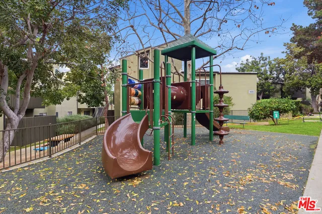 a view of a porch with furniture and a yard