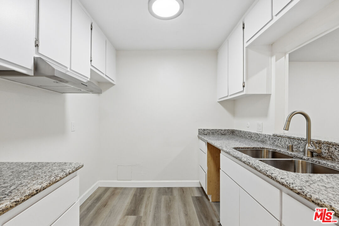 4836 Hollow Corner Road, Unit 312 Culver City, CA 90230 - Photo 6 of 29 a kitchen with a sink and cabinets
