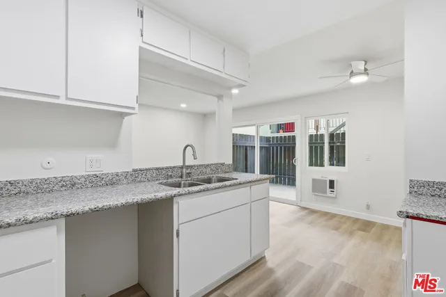 a kitchen with a sink and cabinets