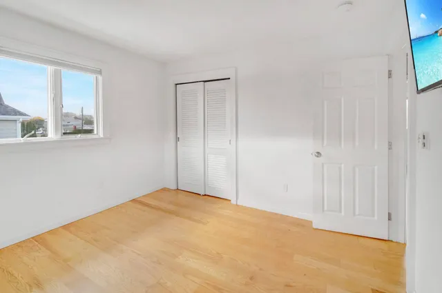 a view of empty room with windows