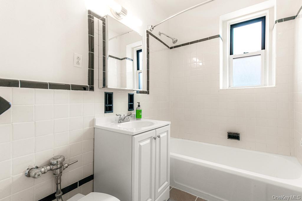 100-10 67th Road, Unit 6L Queens, NY 11375 - Photo 24 of 26 a bathroom with a sink a toilet and shower