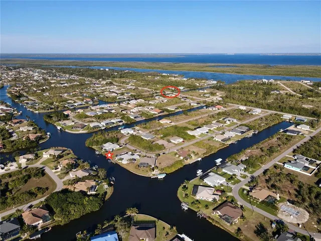 an aerial view of residential building and ocean