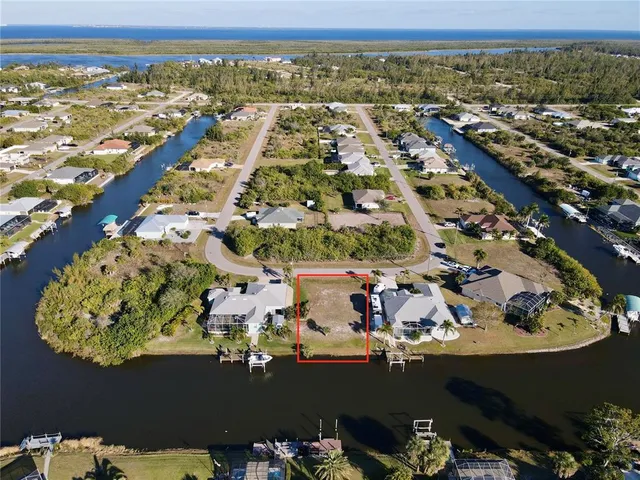 an aerial view of a residential houses with outdoor space