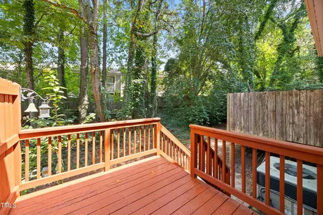 a view of wooden deck and a yard