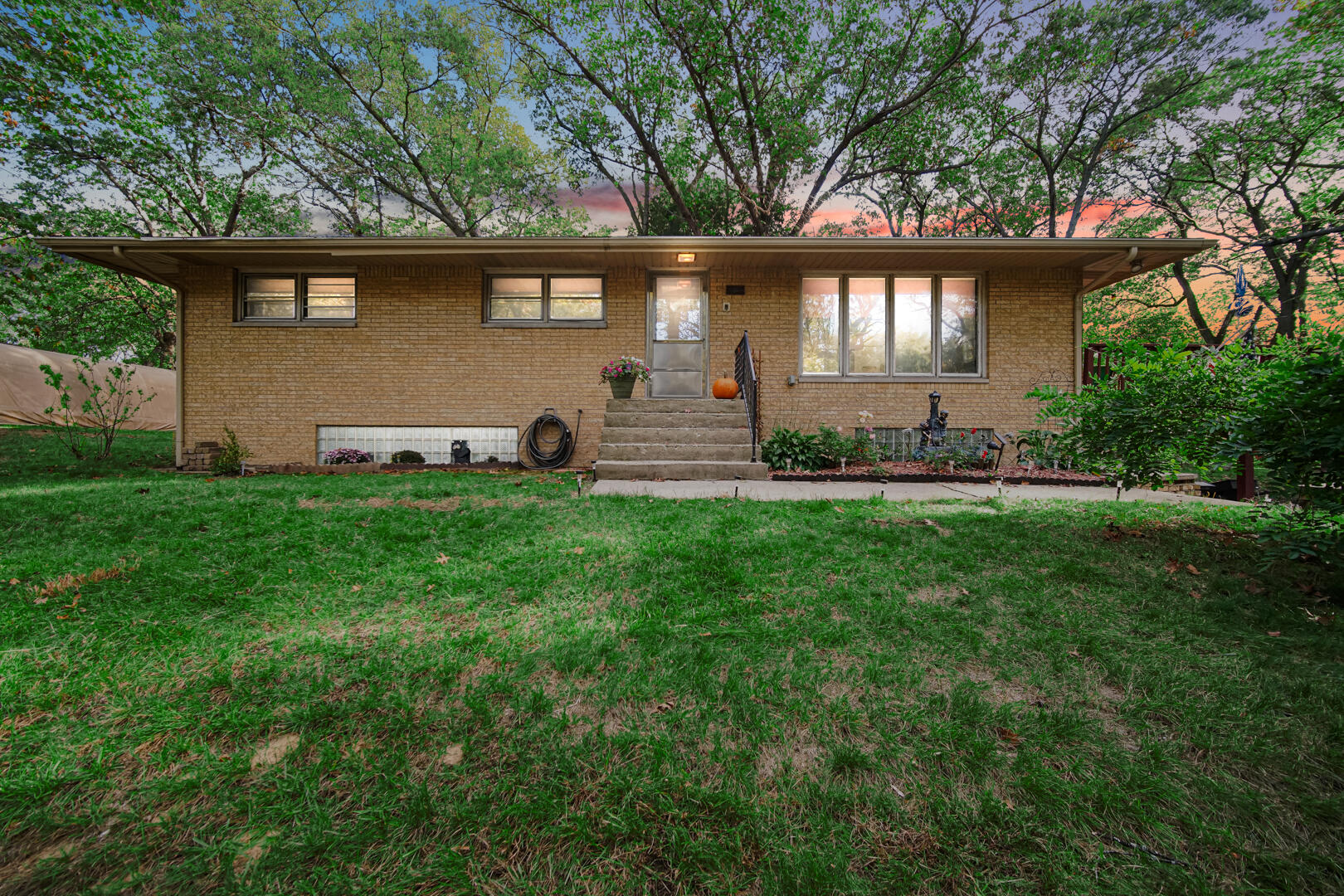 5001 Marquette Road Lake Station, IN 46405 - Photo 2 of 32 a front view of a house with a garden and yard