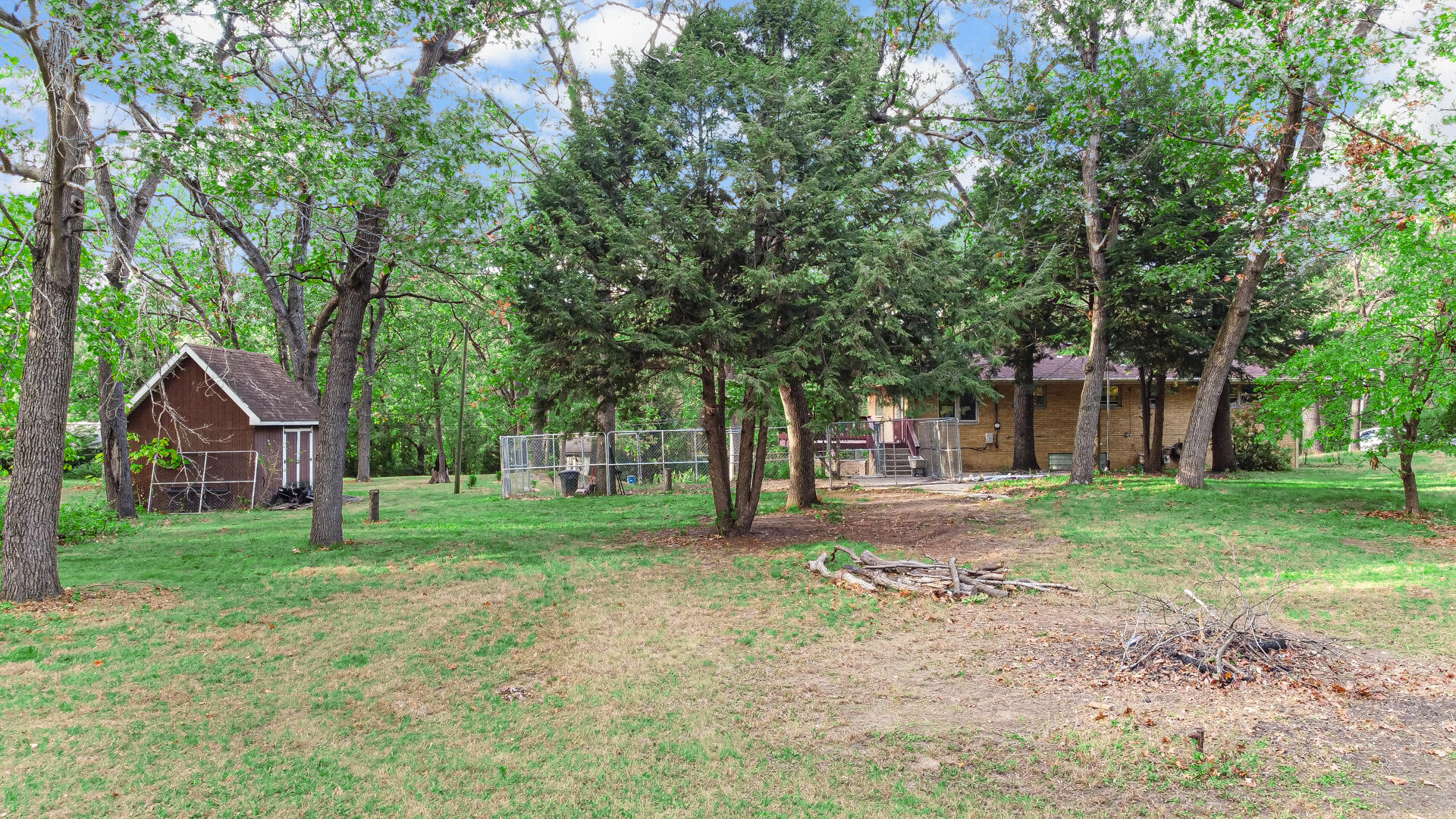 5001 Marquette Road Lake Station, IN 46405 - Photo 25 of 32 a view of a yard with a house and large trees