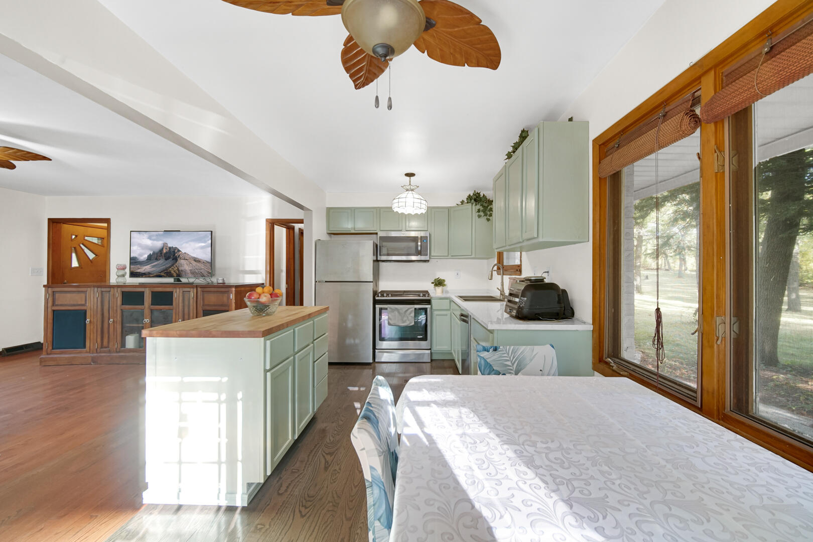5001 Marquette Road Lake Station, IN 46405 - Photo 7 of 32 a kitchen with stainless steel appliances kitchen island granite countertop a sink stove and a refrigerator