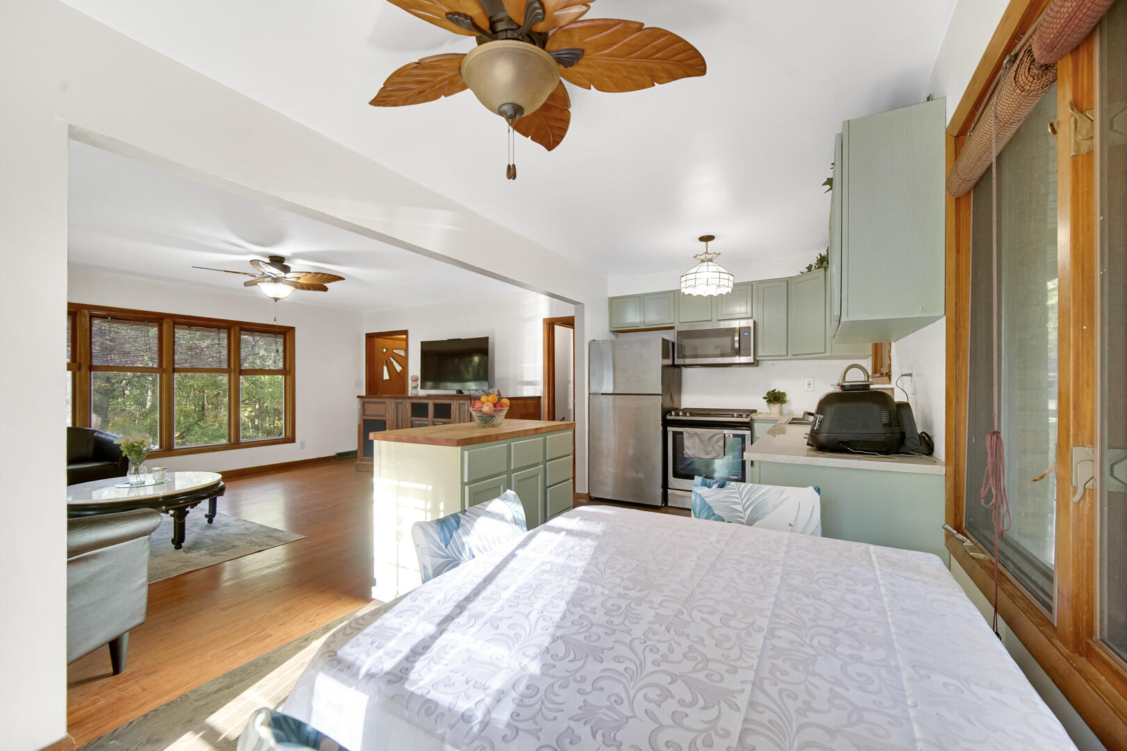 5001 Marquette Road Lake Station, IN 46405 - Photo 8 of 32 a kitchen view with living room flat screen tv and outdoor view