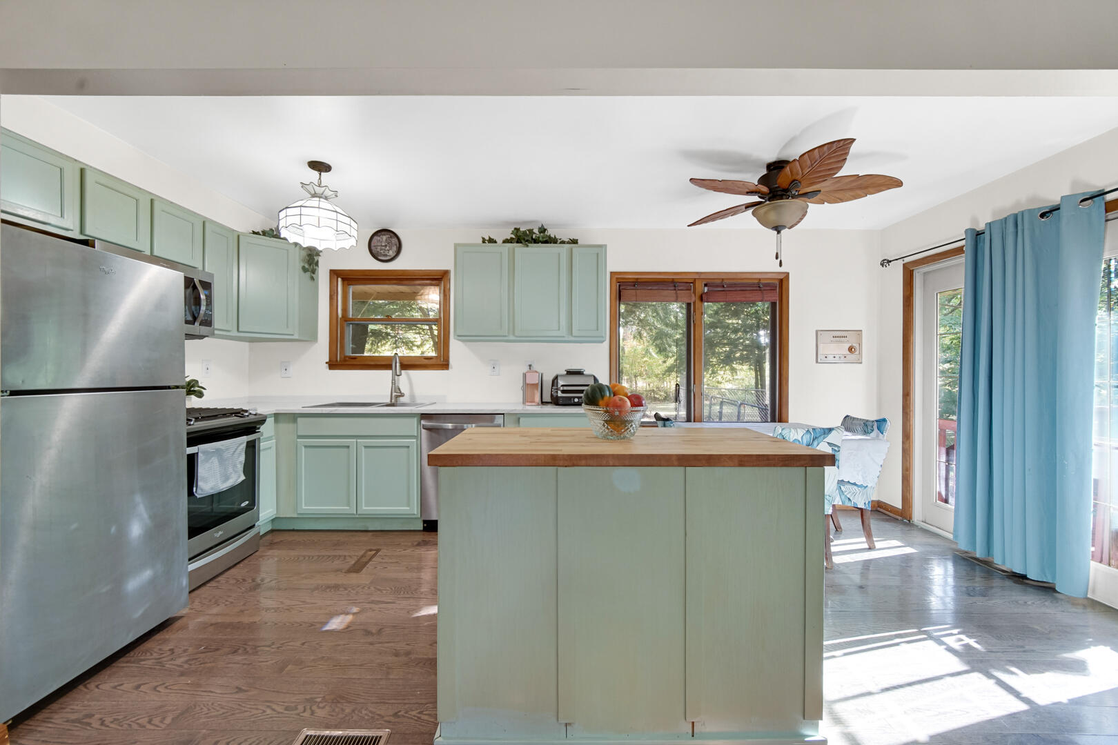 5001 Marquette Road Lake Station, IN 46405 - Photo 10 of 32 a kitchen with kitchen island a counter space a sink and appliances