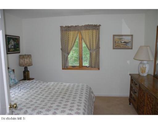 95 N Road Monroe, MA 01350 - Photo 14 of 22 a bedroom with a bed and a window