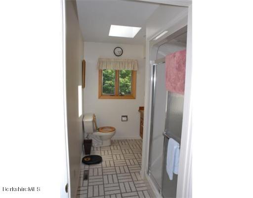 95 N Road Monroe, MA 01350 - Photo 15 of 22 a bathroom with a toilet and a shower