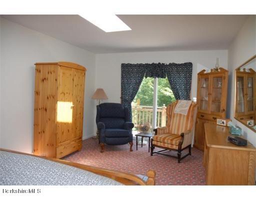 95 N Road Monroe, MA 01350 - Photo 16 of 22 a living room with furniture a window and a fireplace