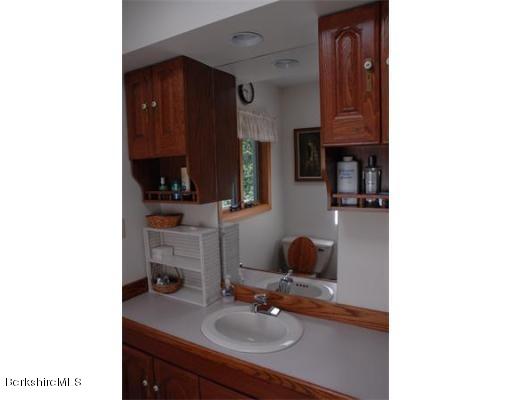 95 N Road Monroe, MA 01350 - Photo 20 of 22 a bathroom with a sink and a mirror