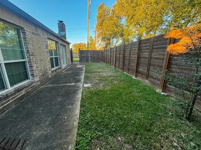 a view of backyard with green space