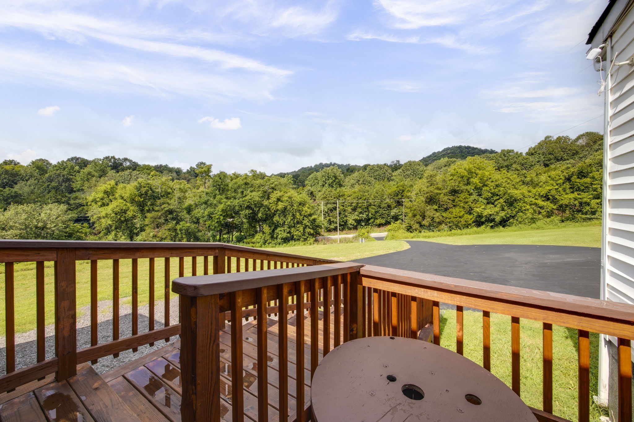 3203 Statesville Road Watertown, TN 37184 - Photo 14 of 56 a view of a balcony with wooden floor and fence