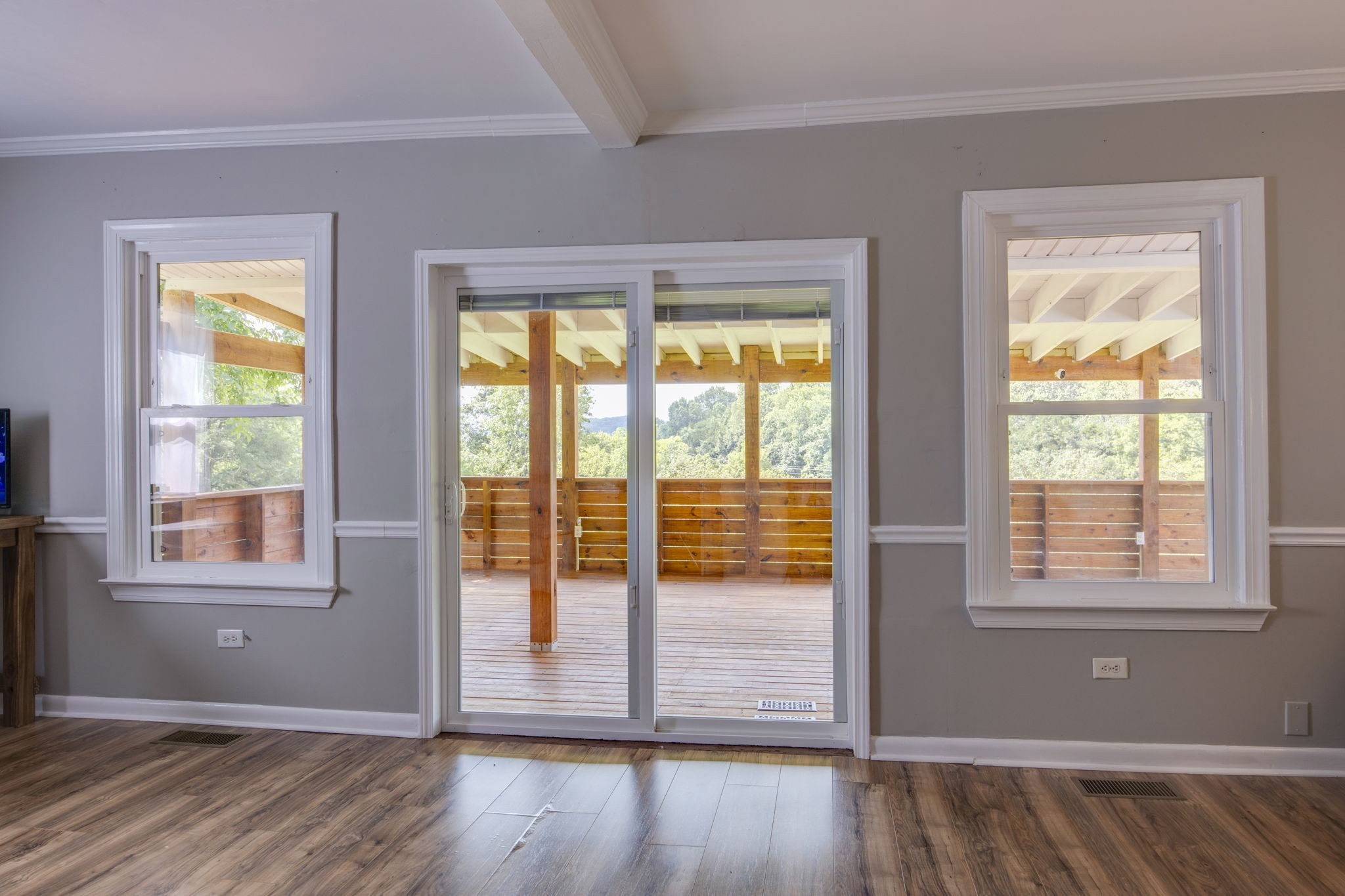 3203 Statesville Road Watertown, TN 37184 - Photo 16 of 56 an empty room with wooden floor and windows