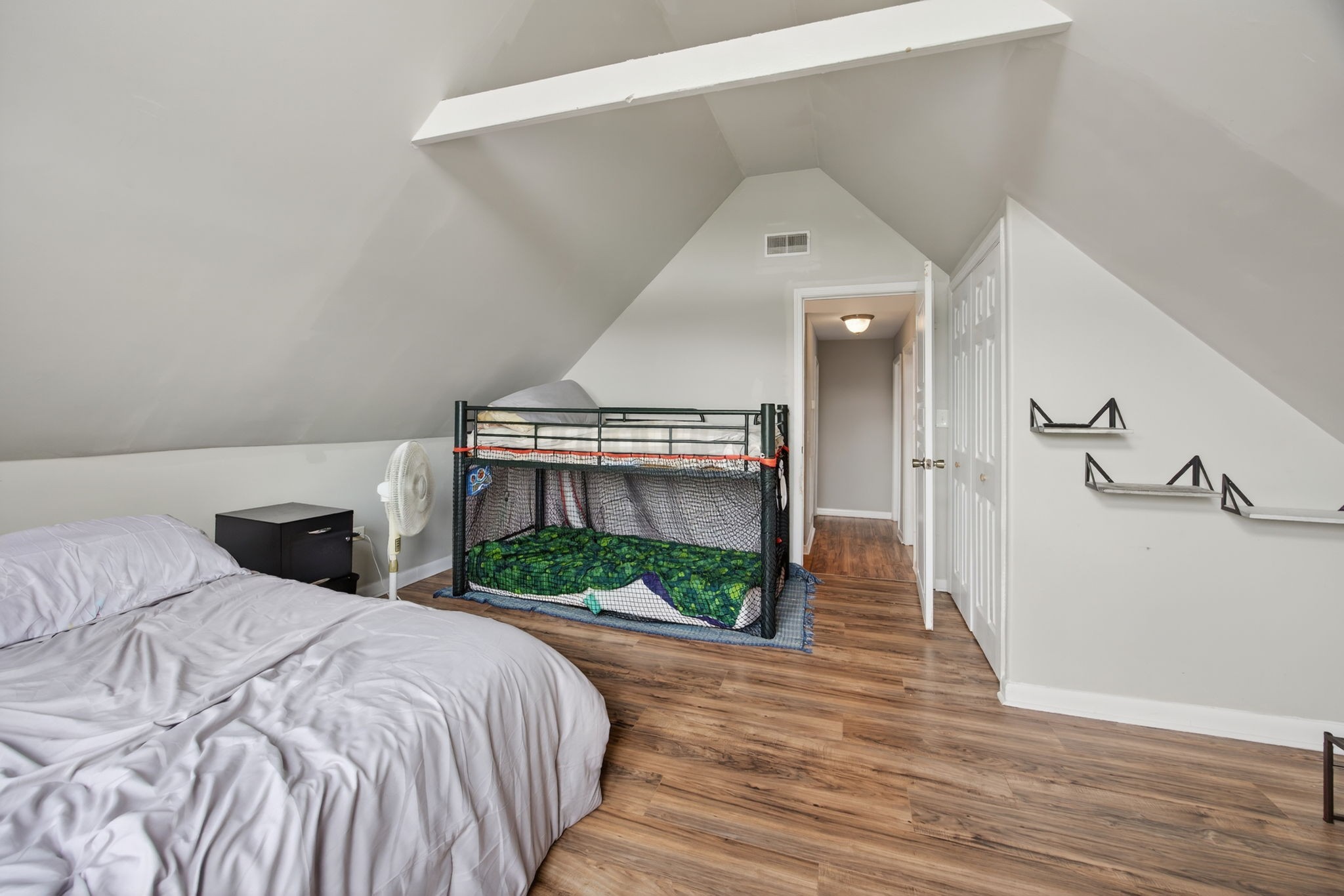 3203 Statesville Road Watertown, TN 37184 - Photo 28 of 56 a bedroom with a bed and a fireplace