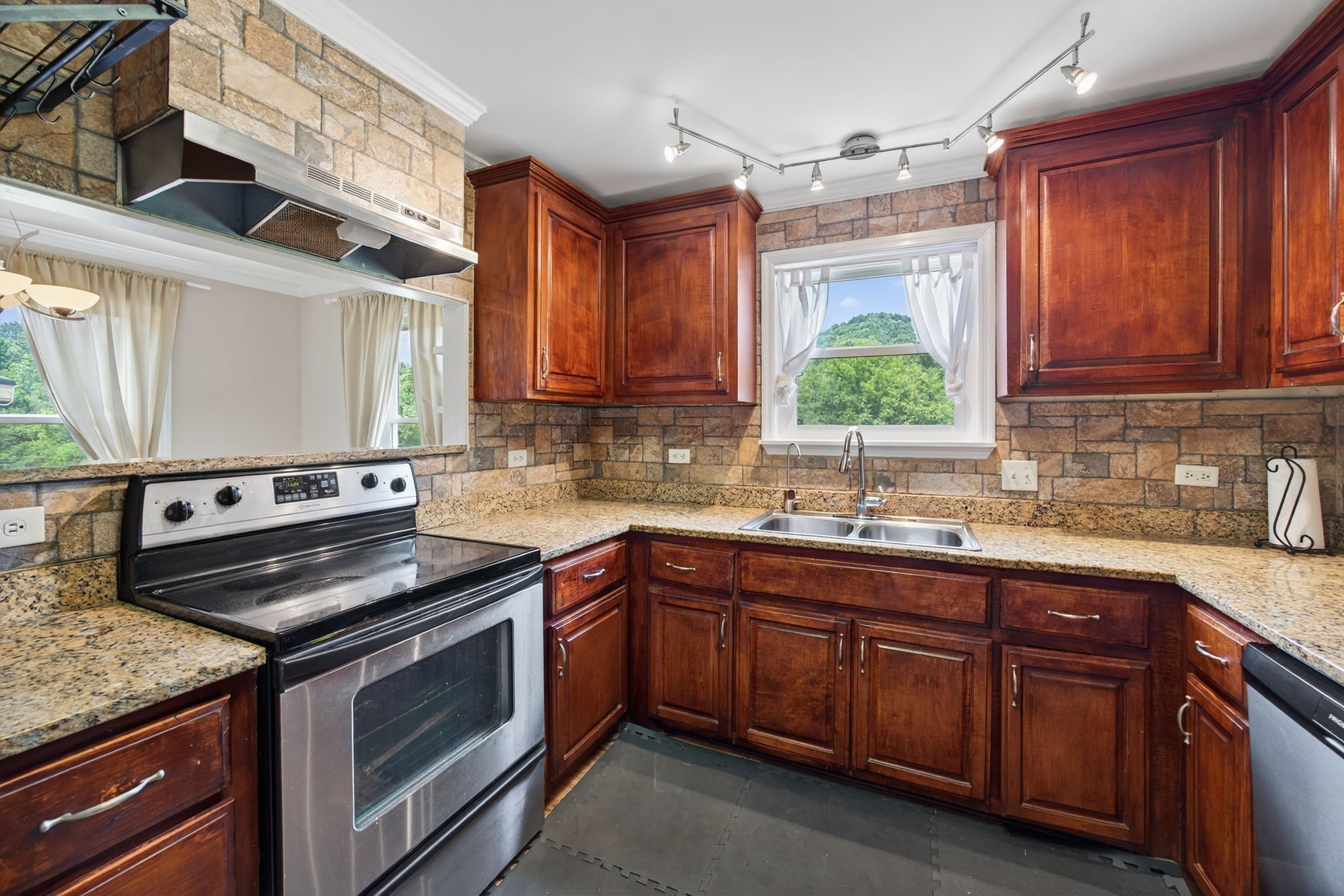 3203 Statesville Road Watertown, TN 37184 - Photo 35 of 56 a kitchen with granite countertop a sink stainless steel appliances and cabinets