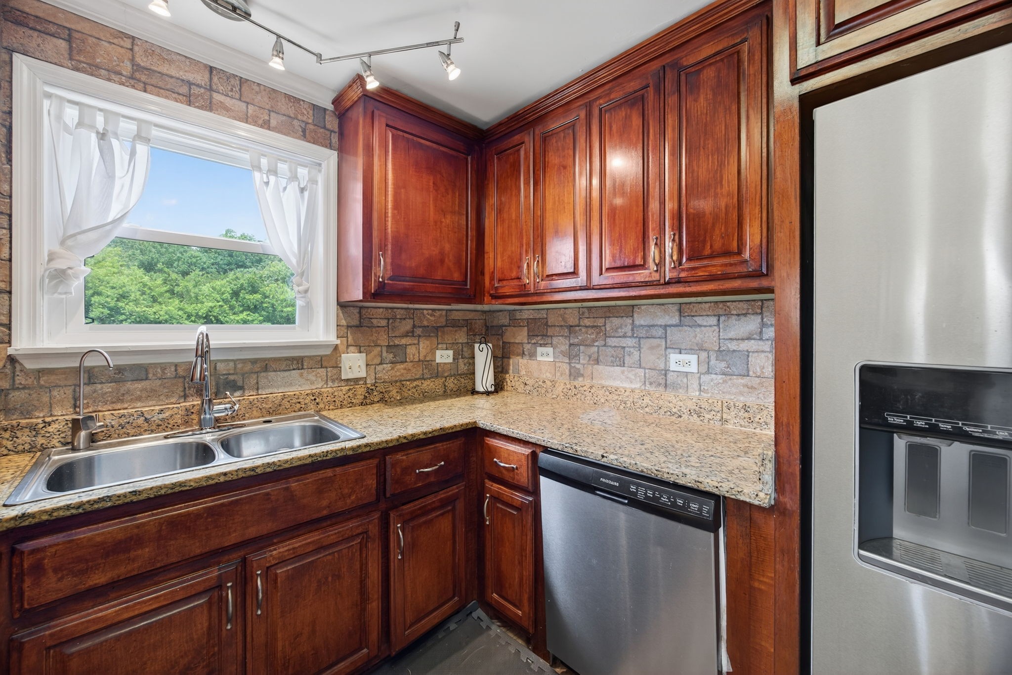 3203 Statesville Road Watertown, TN 37184 - Photo 36 of 56 a kitchen with stainless steel appliances granite countertop a sink stove and cabinets