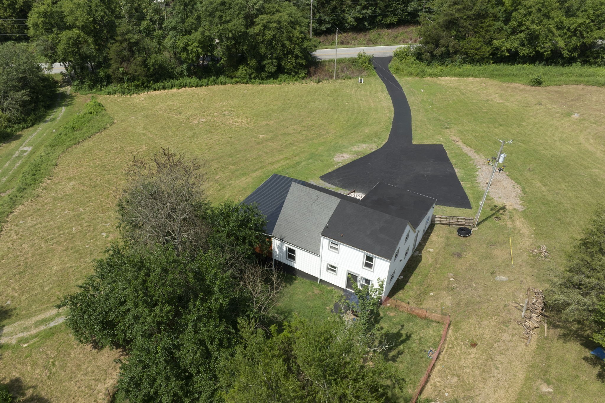 3203 Statesville Road Watertown, TN 37184 - Photo 40 of 56 an aerial view of a house with outdoor space and a lake view