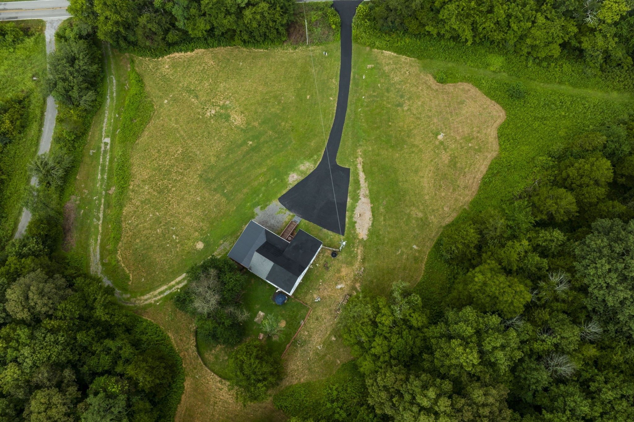 3203 Statesville Road Watertown, TN 37184 - Photo 41 of 56 an aerial view of a residential houses with outdoor space and trees all around