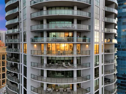a view of a brick building next to a yard