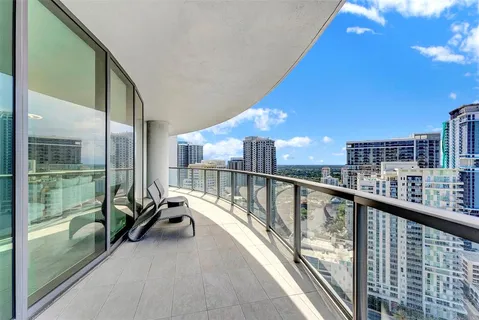 a bedroom with a large bed and a dresser