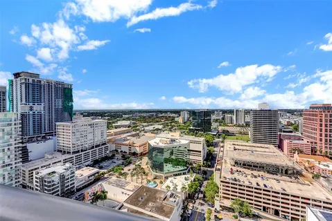 a bedroom with a large bed and a large window