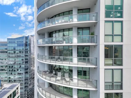 a city street filled with lots of tall buildings
