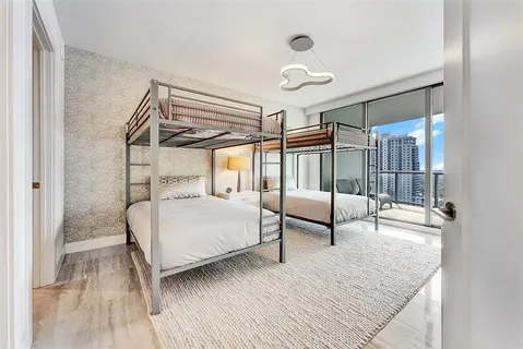 a bedroom with a bed and a couch