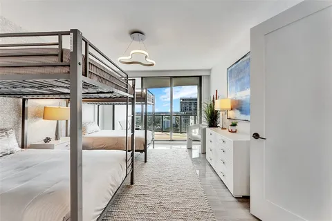 a bathroom with a glass shower door and a bathtub