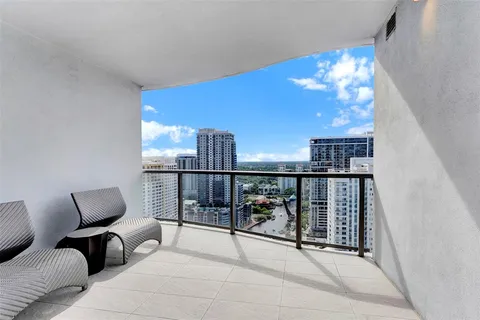 a kitchen with stainless steel appliances kitchen island granite countertop a refrigerator and microwave