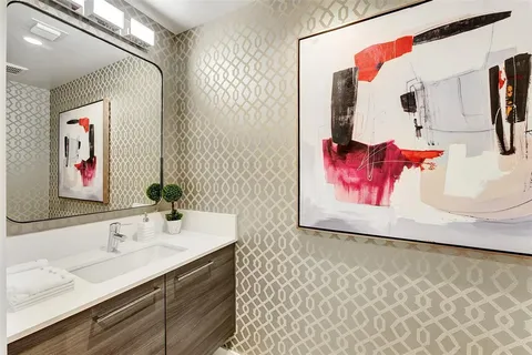 a view of a swimming pool with outdoor seating and a garden