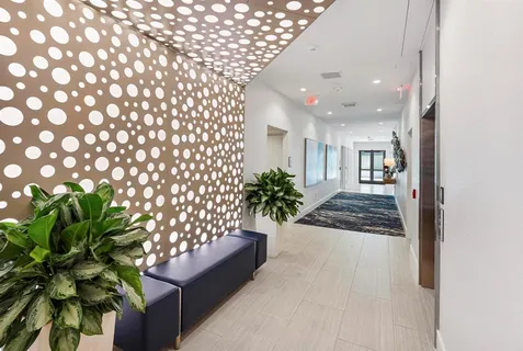 a building outdoor space with patio furniture and potted plants