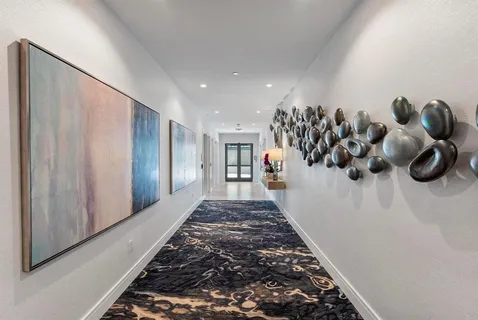 a view of a house with swimming pool and sitting area