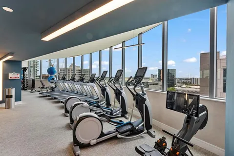 a view of bathroom with a large window and wooden floor