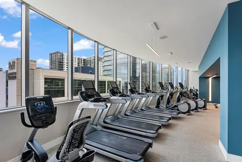 a terrace with a bench and city view
