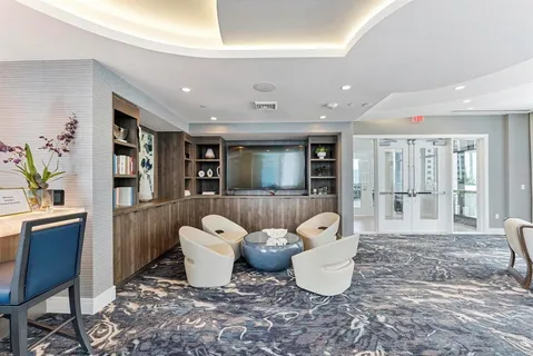 a terrace with a bench and city view