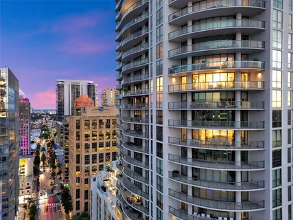 a view of a livingroom with furniture and a potted plant