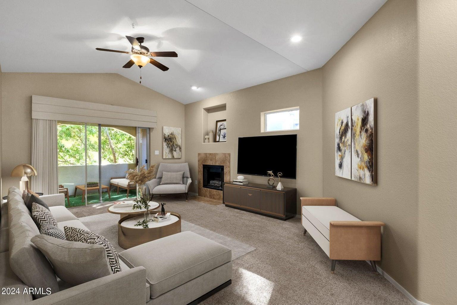 8653 East Royal Palm Road, Unit 2014 Scottsdale, AZ 85258 - Photo 1 of 4 a living room with furniture and a flat screen tv