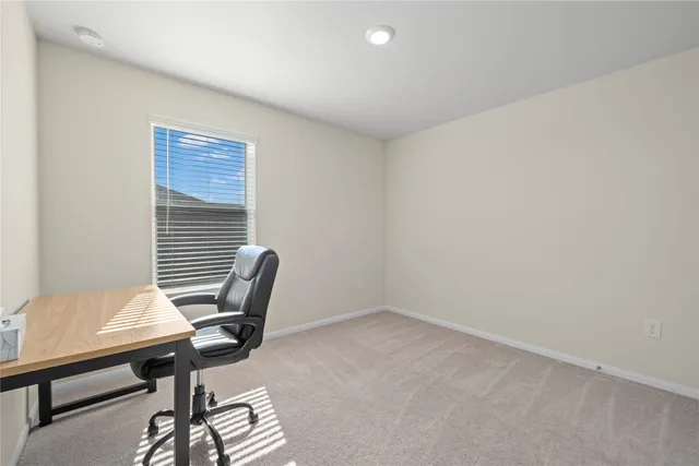 a workspace with furniture and a window