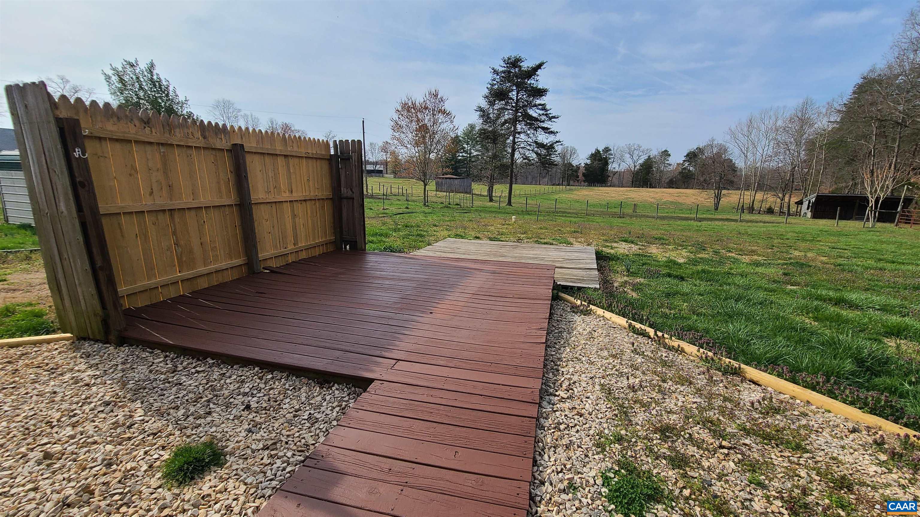 240 Lee Wayside Road Buckingham, VA 23921 - Photo 20 of 42 a view of a backyard with wooden fence