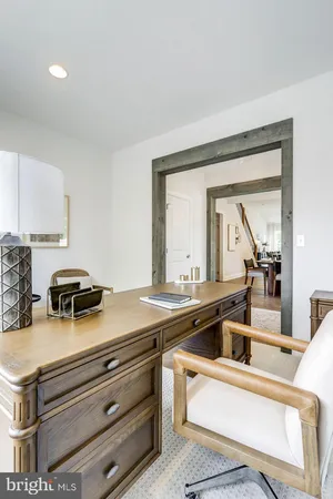 a view of kitchen with sink and natural light