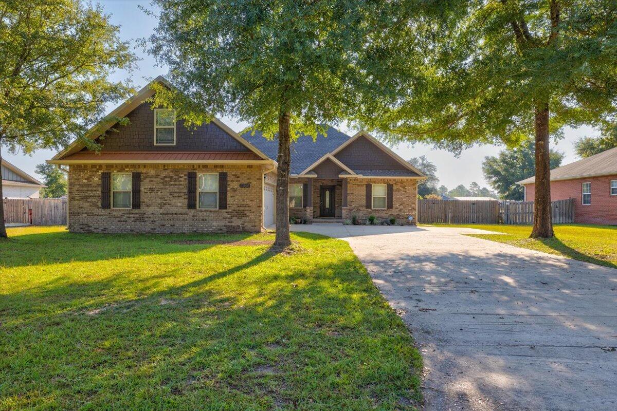 3956 Painter Branch Road Crestview, FL 32539 - Photo 1 of 28 a front view of a house with a yard