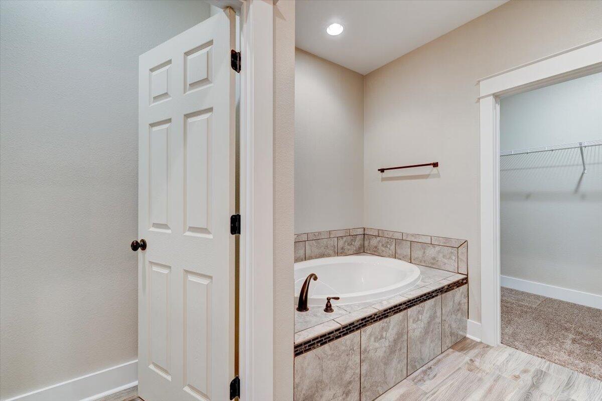 3956 Painter Branch Road Crestview, FL 32539 - Photo 13 of 28 a bathroom with a tub and shower